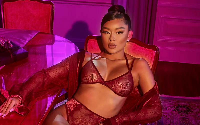 Ayeye Stripped campaign portrait in a deep red room