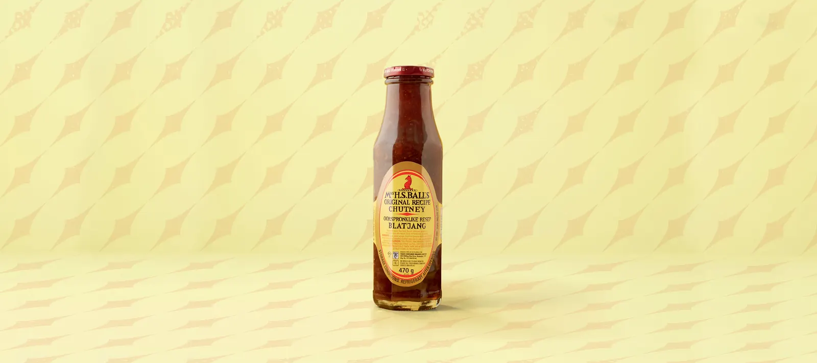 Mrs Ball’s chutney bottle on a pale patterned background